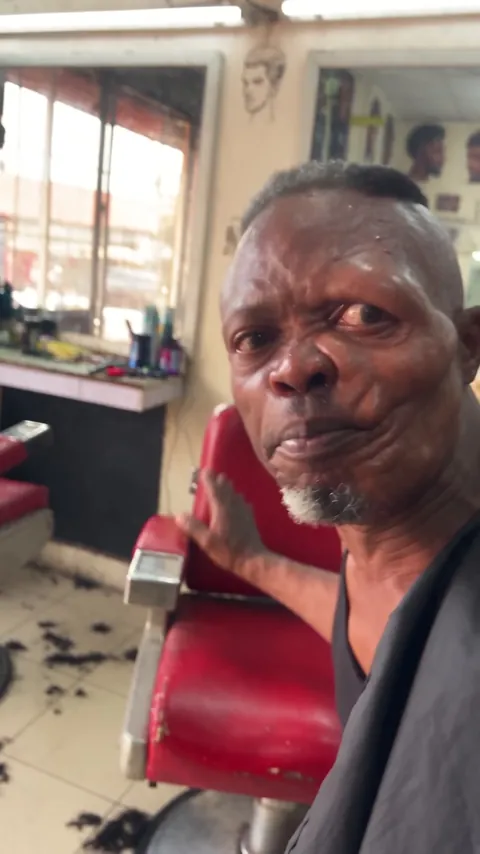 Tunde Adeyemi, barber, at his barbershop in Surulere, Lagos