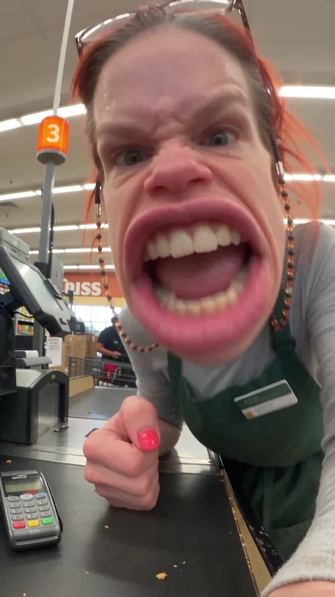 Brenda Kowalski, cashier, at checkout lane 3 of a suburban supermarket
